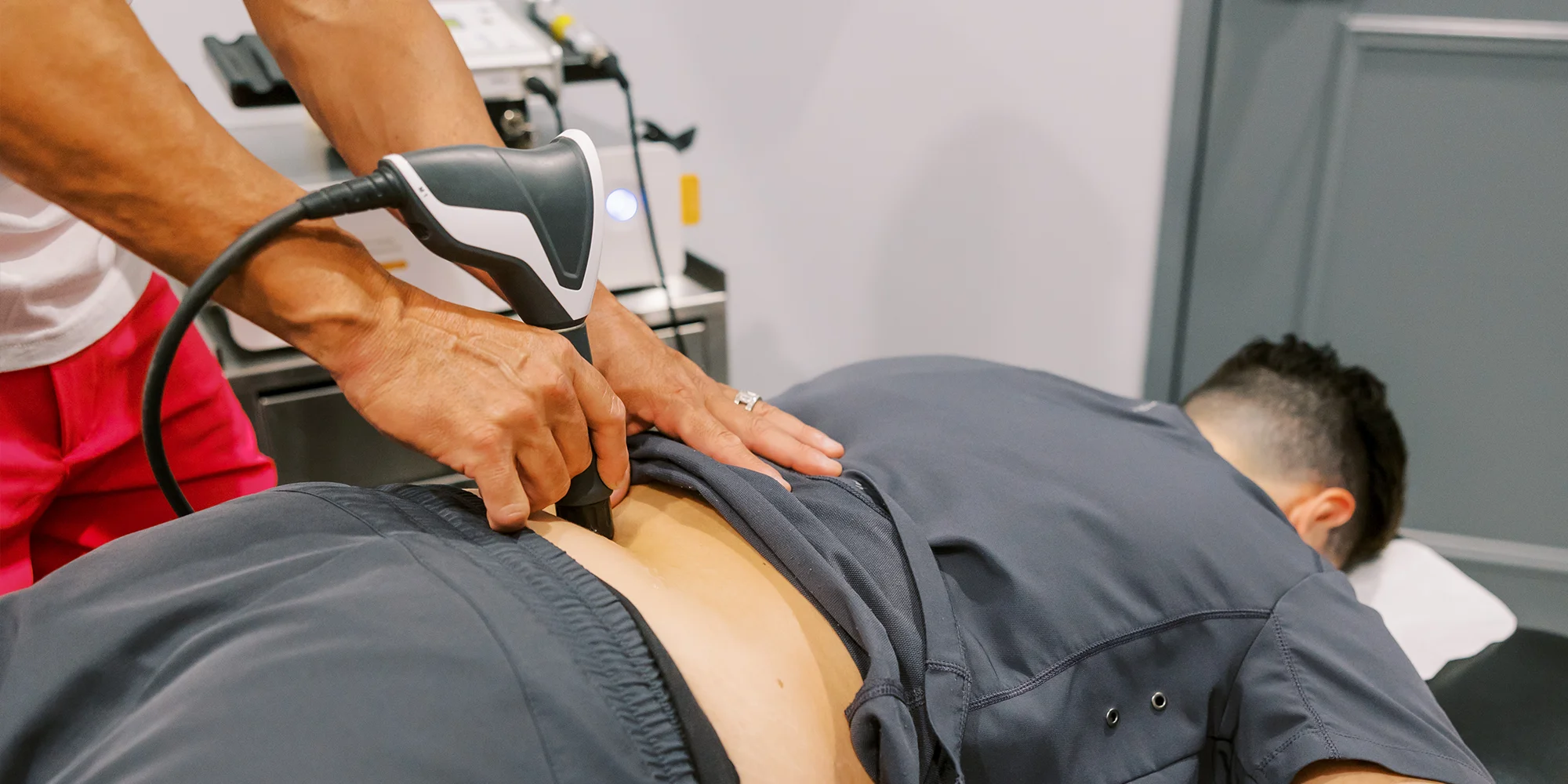 Chiropractic Chandler AZ Patient Receiving Shockwave Therapy On Back Chiropractic Chandler AZ Patient Receiving Shockwave Therapy On Back